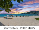 Patong Beach Phuket Thailand nice white sandy beach clear blue and turquoise waters and lovely blue skies with Palms tree sunset sunrise