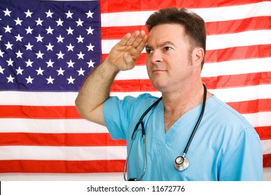 Patriotic American Doctor Giving A Salute To The Flag.  Photographed In Front Of Flag, Not A Composite Image.