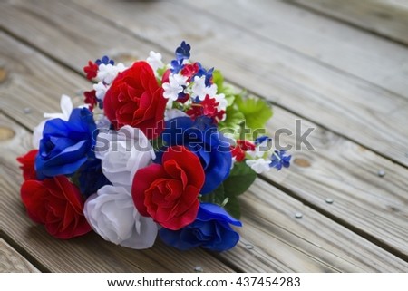 Patriotic colored  flowers on rustic wood