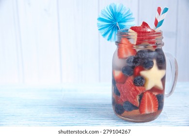 Patriotic Drink Cocktail With Strawberry, Blueberry And Apple