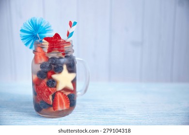 Patriotic Drink Cocktail With Strawberry, Blueberry And Apple