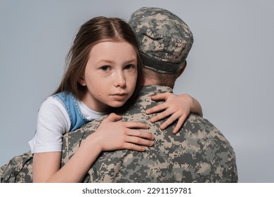 patriotic girl hugging father in army uniform and crying during memorial day isolated on grey - Powered by Shutterstock