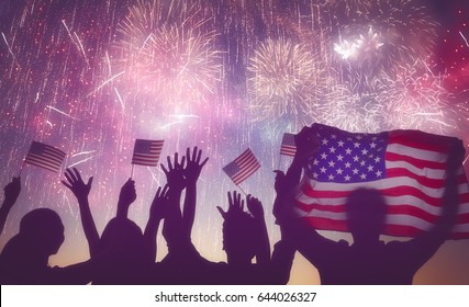 Patriotic holiday. Silhouettes of people holding the Flag of USA. America celebrate 4th of July. - Shutterstock ID 644026327