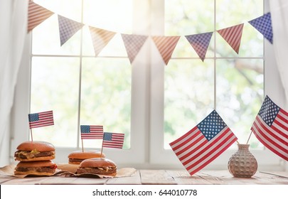 Patriotic holiday. USA are celebrate 4th of July. Top view with American flag on the table. - Powered by Shutterstock