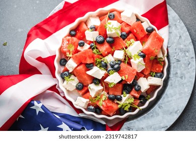 Patriotic salad idea with blueberries, feta and watermelon  on gray background, USA Independence Day, Top view - Powered by Shutterstock