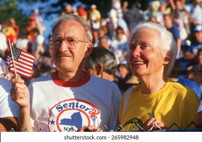 A Patriotic Senior Couple Watching The Senior Olympics, St. Louis, MO