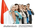 patriotic students smiling while standing and holding indonesian flag with fist hand gesture