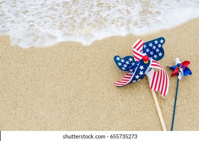 Patriotic USA background with decorations on the sandy beach - Shutterstock ID 655735273