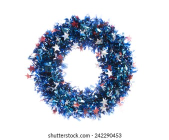 Patriotic Wreath With Cut Out Stars And Tinsel Isolated On White