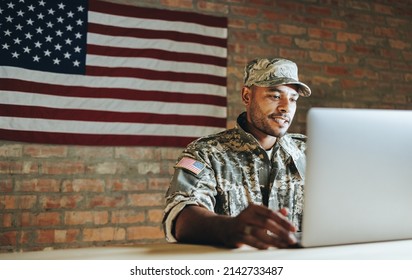 Patriotic Young Soldier Video Chatting With His Family From The Military Base. American Serviceman Communicating With His Loved Ones While Serving His Country In The Army.