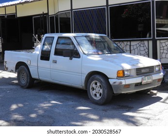 Pattaya, Chonburi province, Thailand - February 16 2020: private 4wd 4x4 awd white color pick-up delivery truck 80s 90s Isuzu TFR (TF) diesel, popular bestseller used work asian car parking on street