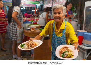 PATTAYA, THAILAND - APRIL 4, 2015; Traders At The Night Market In Thailand