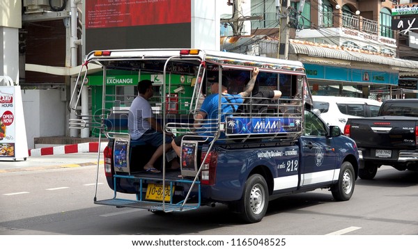 PATTAYA,  THAILAND -\
CIRCA AUGUST 2018 : SONGTHAEW at the street.  It is a passenger\
vehicle in Thailand adapted from a pick-up or a larger truck and\
used as a share taxi.