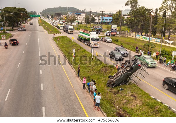 PATTAYA, THAILAND\
- NOV 22, 2015 - Car crash accident on the highway, on a wet road\
after rain, the driver lost control and jumped to the roadside\
overturned, nobody was\
killed