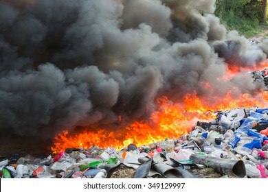 PATTAYA,THAILAND  - DECEMBER 9 : The burning of big pile rubbish beside the street  on December 9,2015 in Pattaya,Thailand