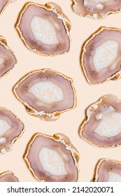 Pattern Of Agate Crystals Isolated On Beige Background,  Top View Natural Slices Beautiful Gemstone. Agate Stone Healing Crystal, Minimal Style Layout, Flat Lay Beige Pink Pastel Color