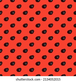 Pattern of avocado haas on a bright red background. Top view, banner or endless pattern. Pop art design, creative summer food concept. Green avocados, minimal flat style.