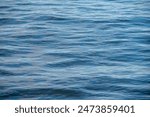 pattern of blue river water with small waves