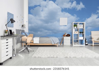 Pattern of blue sky with clouds on wallpaper in furnished room. Beautiful interior design - Powered by Shutterstock