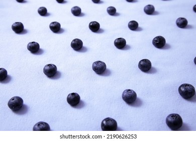 Pattern Of Blueberries On A Lilac Field