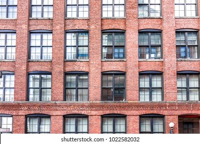 Pattern of brick glass window building in Brooklyn, NYC, New York City, front exterior grunge old architecture