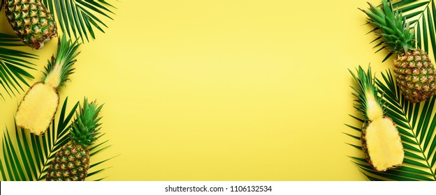 Pattern with bright pineapples on yellow background. Top View. Copy Space. Minimal style. Pop art design, creative summer concept. Banner