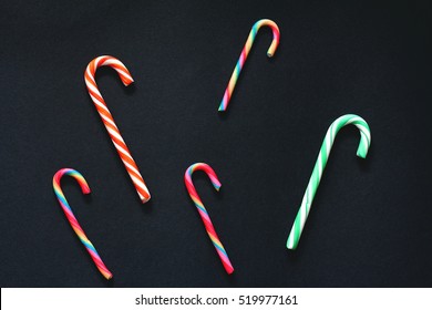 Pattern Of Christmas Candy Cane.  Black Background, Top View, Flat Lay