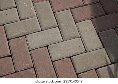 A pattern of city street bricks with two tone colour - Powered by Shutterstock