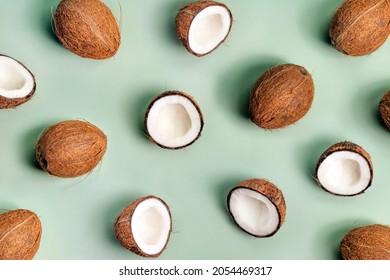 Pattern With Coconuts On Green Background. Top View. Creative Summer Concept.