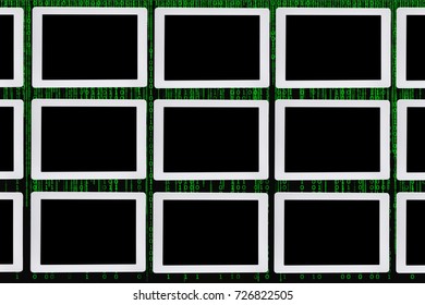 Pattern of computer tablet on green binary code decimal background, copy space idea
