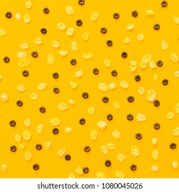 pattern of corn flakes and a chocolate cereal for Breakfast on a yellow background