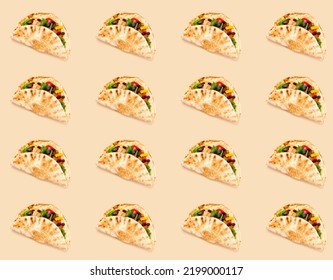 Pattern of Corn tortilla tacos with vegetable filling on background in shades of beige. Traditional dish of Mexican cuisine or World Vegan Day. Creative space for packaging design. Close-up - Powered by Shutterstock