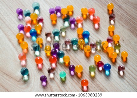 A pattern created by some colorfull rubber balls