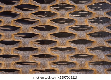 Pattern - Decorative rusty metal wall with eye-like holes - Vilnius, ‘Uzupis’, September 2023