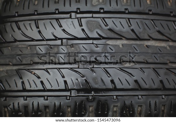 pattern\
drawing on a car tire wheel macro\
photography