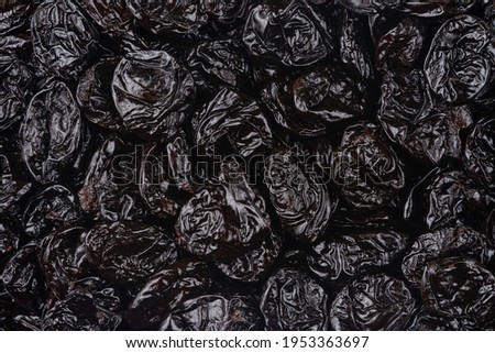 Pattern of dried prunes. Top view, overhead.
