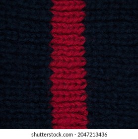 Pattern Fabric Made Of Wool. Handmade Knitted Fabric Red And Navy Wool Background Texture