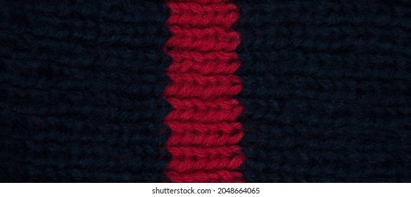 Pattern Fabric Made Of Wool. Handmade Knitted Fabric Red And Navy Wool Background Texture