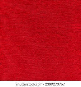 Pattern fabric made of wool. Handmade knitted fabric red wool background texture