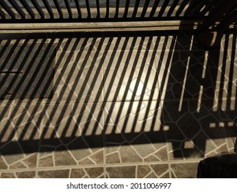 pattern is formed because the shadow of fence