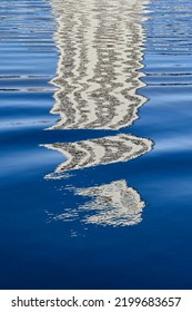 Pattern Formed By The Reflection Of A Skyscraper On Rippled Water. No People.