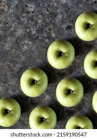 Pattern Of Green Apples On Black Concrete Background With Copy Space. Granny Smith. Fresh Fruits Background.