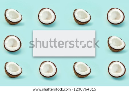 Pattern with half of shell coconuts and lable for text on blue background. Top View,minimalism, creative cocnuts concept.