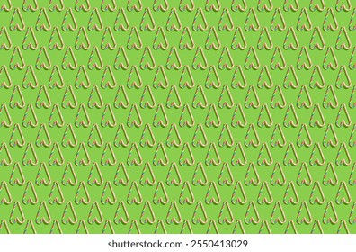 Pattern of hard candy cane heart on green pastel background