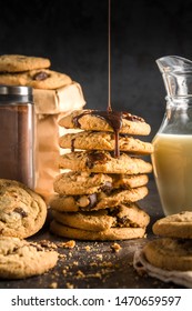 Pattern image of The different Creamy Dark Chocolate cookies tower rich of butter poured with dark chocolate syrup set on the abstract color sheet table background ; made freshly