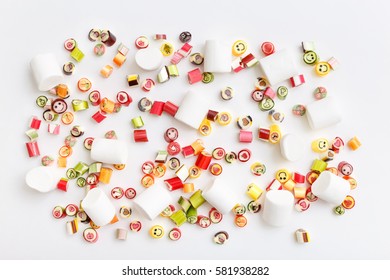 Pattern lollipops, candy on colorful white background, top view flat lay. Sweet sucker, lollipop, candy, isolated minimal concept above decoration, food background