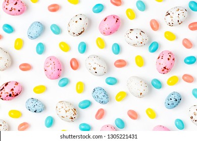 Pattern  Made Of Easter Candy Chocolate Eggs And Jellybean On White Background