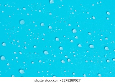 Pattern made of lots of little water dew drops shining and glowing on bright sunlight as mock up with copy space, macro
