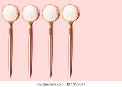 Pattern Made With Spoons With Collagen Or Protein Powder On Pale Pink Background.  Natural Beauty And Health Supplement. Plant Or Fish Based. Flat Lay, Top View. Copy Space.