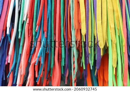 Pattern of many colorful bright shoelaces